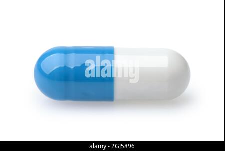 Side view of single blue and white medical capsule isolated on white Stock Photo