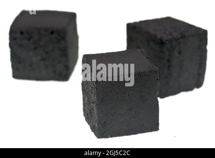 Charcoal cubes for hookah on white background Stock Photo