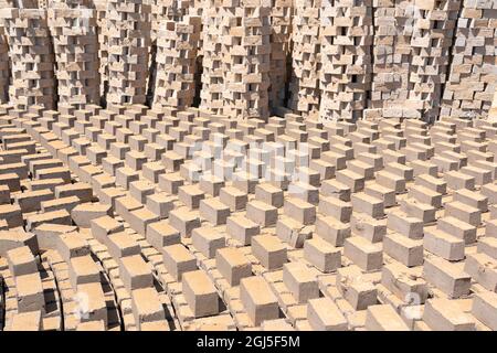 Africa, Madagascar, Antananarivo. Bricks are set out to dry in an interesting pattern. Stock Photo