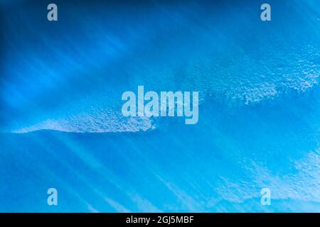 Blue iceberg closeup abstract background Charlotte Bay, Antarctica. Glacier ice blue because air squeezed out of snow. Stock Photo