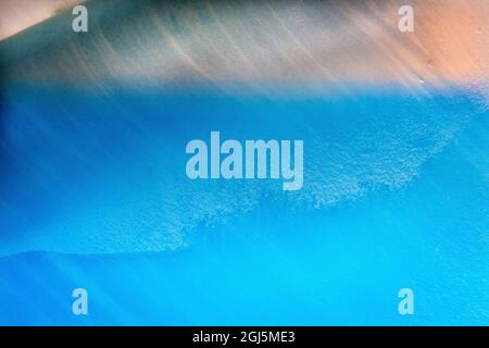 Blue iceberg closeup abstract background Charlotte Bay, Antarctica. Glacier ice blue because air squeezed out of snow. Stock Photo