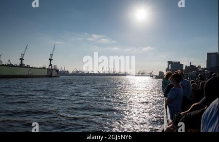 People on a sightseeing boat in the harbor of Hamburg, Germany. Stock Photo