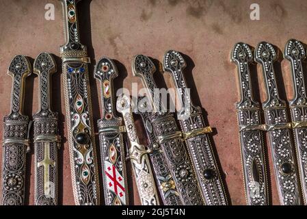 Georgia, Tbilisi. Rustaveli Avenue, souvenirs of traditional Georgian daggers. Stock Photo