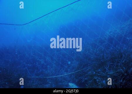 A Fishing Net Underwater Fixed On The Seabed, Deep Water Stock