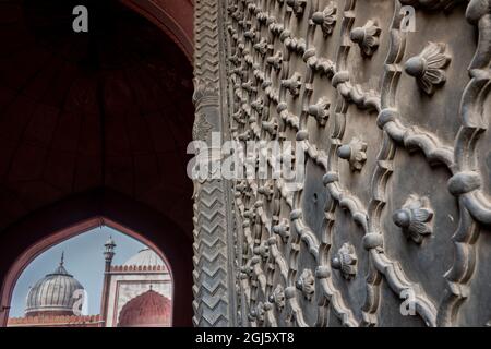 India, Delhi, Old Delhi. Jama Masjid, one of the largest mosques in India, circa 1656 AD. Detail of ornate metal door. Stock Photo