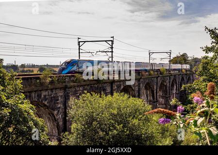 Trans Pennne Express Nova trainset crossing the Sankey Valley viaduct at Earlestown heading east for Newcastle from Liverpool. Stock Photo