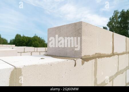 White building blocks close-up. Building a house in blocks on a sunny summer day Stock Photo