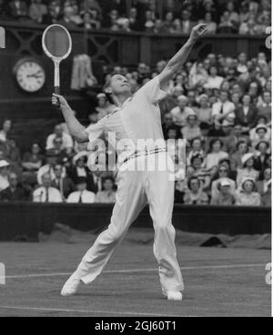 Gottfried von Cramm playing tennis at Wimbledon 25 June 1951 Stock Photo