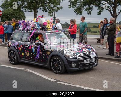 BIDEFORD, NORTH DEVON, ENGLAND - AUGUST 30 2021: Classic mini cars in The Legendary Grand Tour supporting Children's Hospice SW. Fancy dress day, here Stock Photo