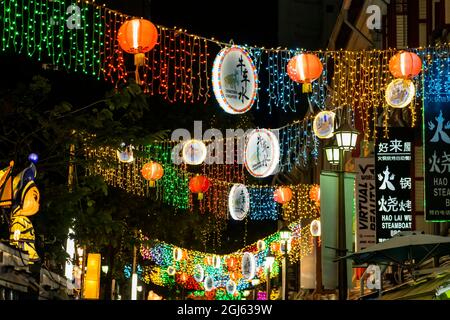Hanging lanterns and lights at night in Chinatown, Singapore. Stock Photo