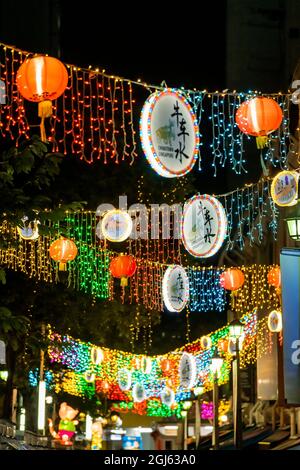 Hanging lanterns and lights at night in Chinatown, Singapore. Stock Photo