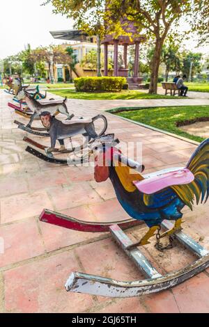 Cambodia, Battambang. Children's rocking horses painted with animal designs. Stock Photo