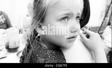 Offended girl cries. B/W photo Stock Photo