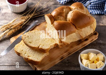 Braided egg bread on wooden table Stock Photo