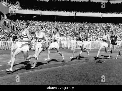 The final bend of the 1500 metres event is Britain's Brian Hewson (162) who is in the lead but about to be overtaken by Ron Delany Irish athlete (102) Melbourne 1 December 1956 Stock Photo