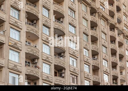 Azerbaijan, Baku. Apartment buildings, Hasanoghlu Street by Heydar Aliyev Center Stock Photo