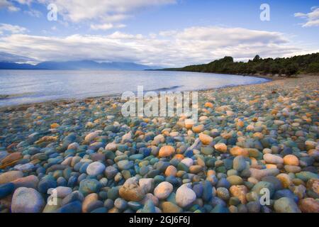 South Island. Rocky shore of Lake Te Anau. Stock Photo