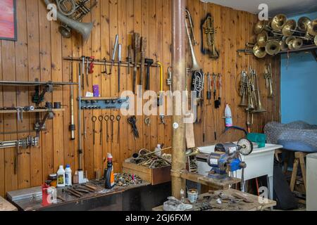 Tools hanging on wall of wind instrument repair shop at the Central National School of Art in Habana, Cuba Stock Photo