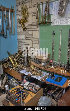 Tools hanging on wall of wind instrument repair shop at the Central National School of Art in Habana, Cuba Stock Photo