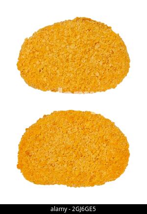 Two vegan breaded cutlets, from above, isolated on white background. Two slices of pre-fried schnitzel, based on soy protein, a meat substitute. Stock Photo