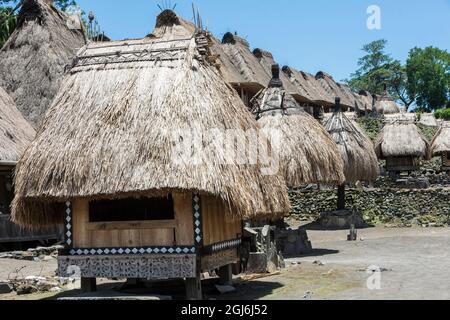 Bhaga, ngadhu and megalithic altars in the center of the traditional village Bena on Flores island, East Nusa Tenggare, Indonesia. Stock Photo