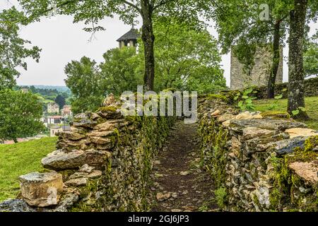 Ruins of the ramparts of the Benedictine priory, perched on a hill, of Crèmieu in France. Crémieu, Auvergne-Rhône-Alpes region, France Stock Photo