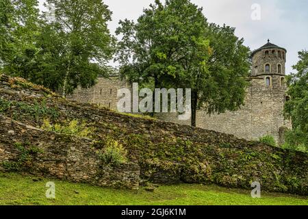 Ruins of the ramparts of the Benedictine priory, perched on a hill, of Crèmieu in France. Crémieu, Auvergne-Rhône-Alpes region, France Stock Photo