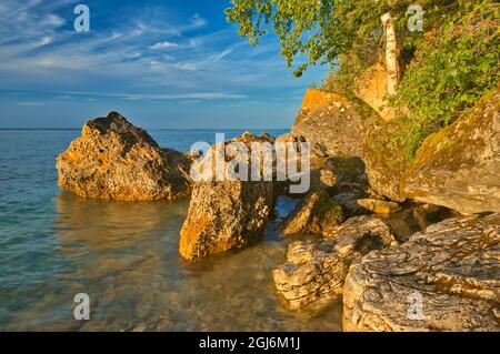 Canada, Manitoba, Clearwater Lake Provincial Park, Rocky shoreline of Clearwater Lake at sunset. Credit as: Mike Grandmaison / Jaynes Gallery / Danita Stock Photo