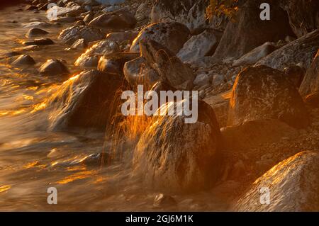 Canada, Manitoba, Clearwater Lake Provincial Park, Rocky shoreline of Clearwater Lake at sunset. Credit as: Mike Grandmaison / Jaynes Gallery / Danita Stock Photo