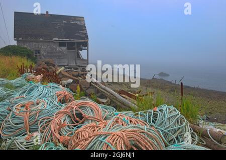 Canada, Nova Scotia, Westport. Fishing rope and shack in fishing village. Credit as: Mike Grandmaison / Jaynes Gallery / DanitaDelimont. com Stock Photo