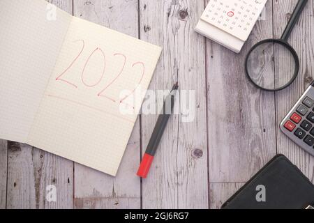 hand written 2020 new year goals on notepad and stationary on table  Stock Photo