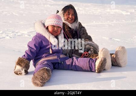 Young Inuit girl in traditional skin clothing. Grise Fjord, Nunavut ...