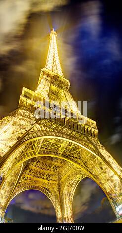 Glow of night and Eiffel Tower in Paris, France. Stock Photo
