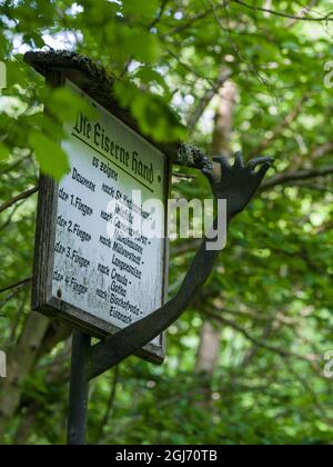 Old signpost Eiserne Hand (iron hand). Hainich woodland in Thuringia, National Park and part of the UNESCO World Heritage Site. Primeval Beech Forests Stock Photo