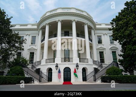 Washington, USA. 19th July, 2021. The flags of the United States and Jordan flank the South Portico entrance of the White House Monday, July 19, 2021, in preparation for a visit from King Abdullah II, Queen Rania and Crown Prince Al Hussein Bin Abdullah II of Jordan. (Official White House Photo by Erin Scott via Credit: Sipa USA/Alamy Live News Stock Photo
