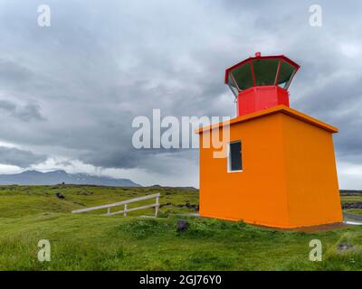 lava flow at coast with lighthouse at Ondverdarnes. Landscape on peninsula Snaefellsnes in western Iceland. (Editorial Use Only) Stock Photo