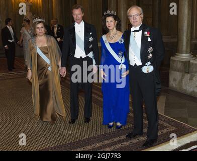 STOCKHOLM - 20111211 Grand Duchess Maria Teresa and Grand Duke Henri of Luxembourg, King Carl XVI Gustaf and Queen Silvia of Sweden arrive to a gala dinner for the Nobel Laureates at Stockholm's Royal Palace Foto: Henrik Montgomery / SCANPIX Kod: 10060 Stock Photo