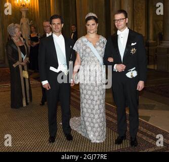 STOCKHOLM - 20111211 Prince Carl Philip, Crown Princess Victoria and Prince Daniel arrive to a gala dinner for the Nobel Laureates at Stockholm's Royal Palace Foto: Henrik Montgomery / SCANPIX Kod: 10060 Stock Photo