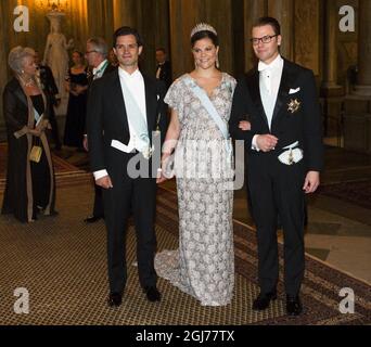 STOCKHOLM - 20111211 Prince Carl Philip, Crown Princess Victoria and Prince Daniel arrive to a gala dinner for the Nobel Laureates at Stockholm's Royal Palace Foto: Henrik Montgomery / SCANPIX Kod: 10060 Stock Photo