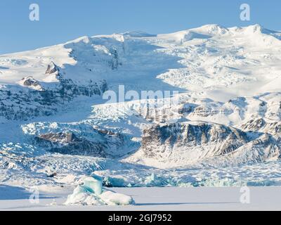 Glacier Fjallsjoekull and frozen glacial lake Fjallsarlon in Vatnajokull National Park during winter. Iceland. Stock Photo