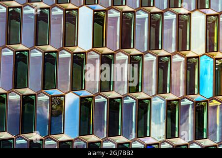 Modern glass abstract background concert hall, Reykjavik, Iceland. Constructed in 2011 of Modern Geometric Shaped glass Panels Stock Photo