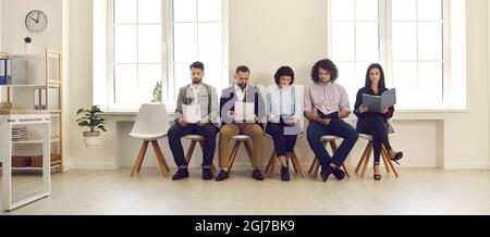 A group of young business team with documents before the working meeting Stock Photo