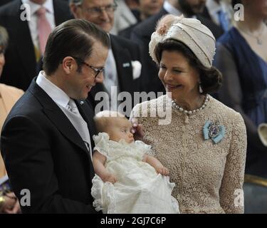 STOCKHOLM 2012-05-22 Prince Daniel, Princess Estelle and Queen Silvia during the christening ceremony of Princess Estelle of Sweden in the Royal Chapel in Stockholm, Sweden May 22, 2012. Princess Estelle is the daughter of Crown Princess Victoria and Prince Daniel of Sweden. Princess Estelle is number two in the Swedish royal succession Photo: Anders Wiklund / SCANPIX / Kod: 10040 Stock Photo