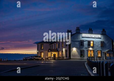 The Causeway Hotel at dusk at the Giants Causeway near Bushmills, Northern Ireland Stock Photo