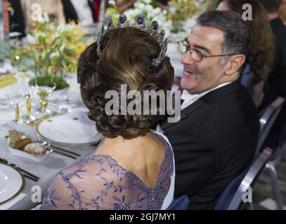 STOCKHOLM 2012-12-10 Queen Silvia and Serge Haroche, Nobel laureate in Physics at the Nobel Banquet in the City Hall in Stockholm Sweden, December 10, 2012. Photo Claudio Bresciani / SCANPIX code 10090   Stock Photo