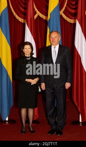 Latvian President Andris Berzins (R) and Queen Silvia of Sweden poses for photographers prior to their meeting in Riga, Latvia on March 20, 2012. Stock Photo