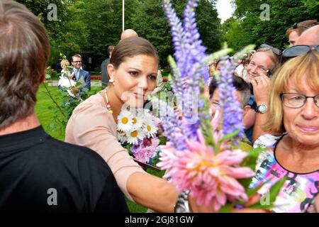BORGHOLM 20130714 Swedish Crown Princess Victoria receives flowers at the courtyard of the royal family's summer residence Solliden, on the island of Oeland, Sweden, on July 14, 2012, during the celebrations of Crown Princess Victorias 36th birthday. Photo: Jonas Ekstromer / SCANPIX / code 610030  Stock Photo