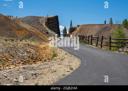 Biking, Mineral Belt Trail through the historic mining district of Leadville active at the turn of the century, Colorado, USA. Stock Photo