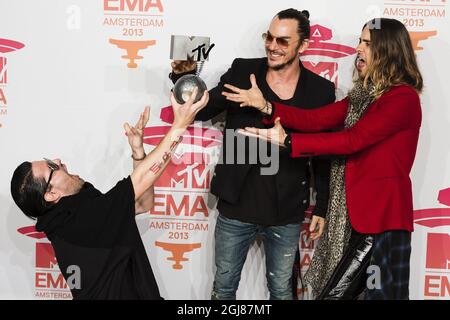 AMSTERDAM 20131110 Members of US rock band Thirty seconds to Mars (from LtoR) Tomo Milicevic, Shannon Leto and Jared Leto pose with their award during the 2013 MTV Europe Music Awards held at the Ziggo Dome in Amsterdam, Netherlands, Sunday November 10, 2013. Foto: Vilhelm Stokstad / TT / Kod 11370  Stock Photo