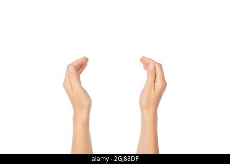 The palms of a hands are in a holding, offering or giving position isolated on white background. Open palm gesture. Stock Photo